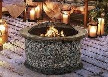 Stone fire pit with sofa bed and blanket