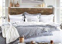 Wooden bed with grey and white sheets