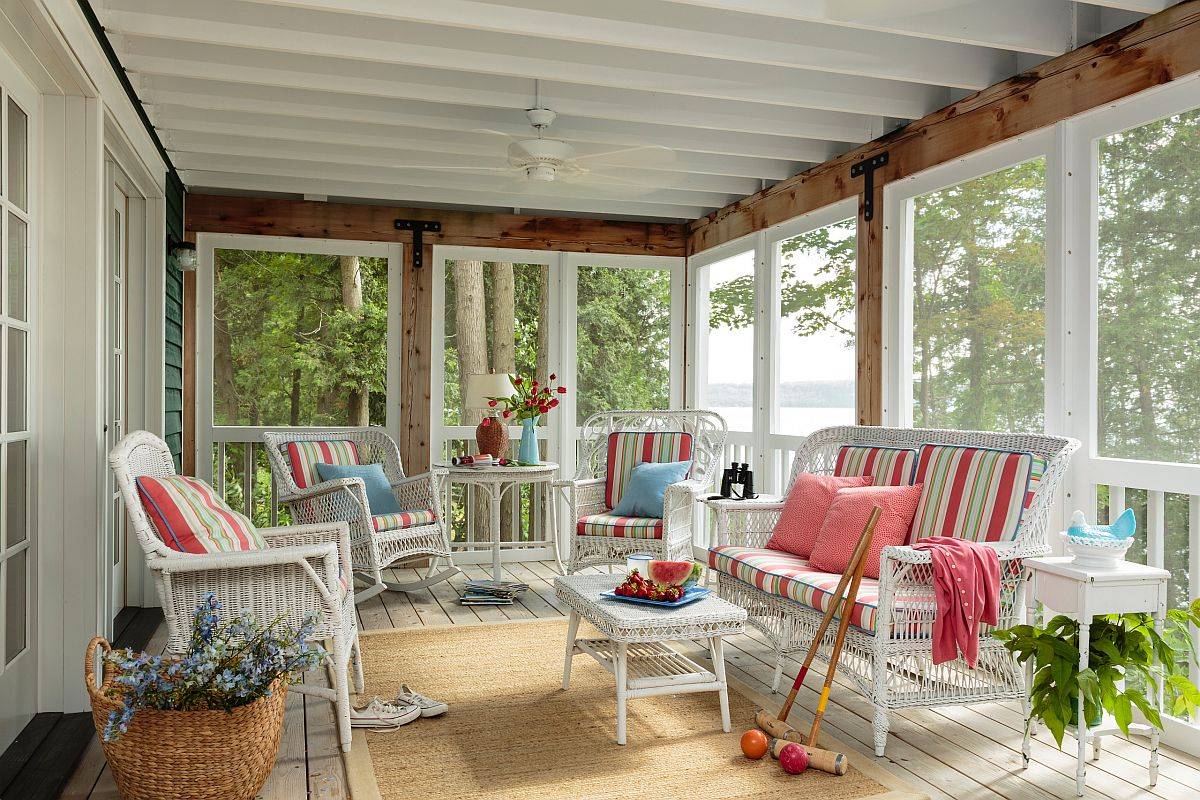 Accent colors on the beautiful white porch give it a bright, summery appeal