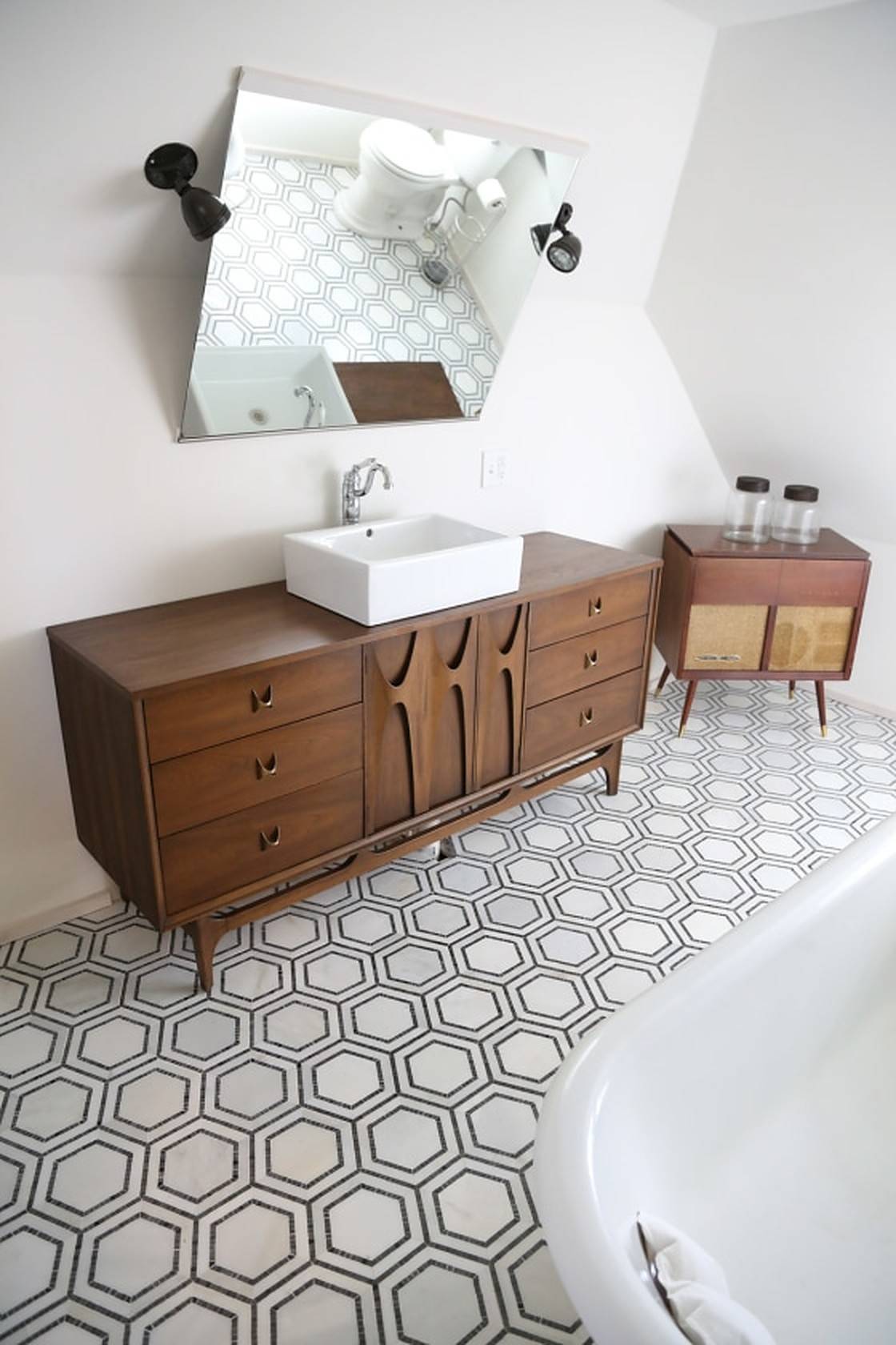 Bathroom with wooden drawers and hexagon tiles