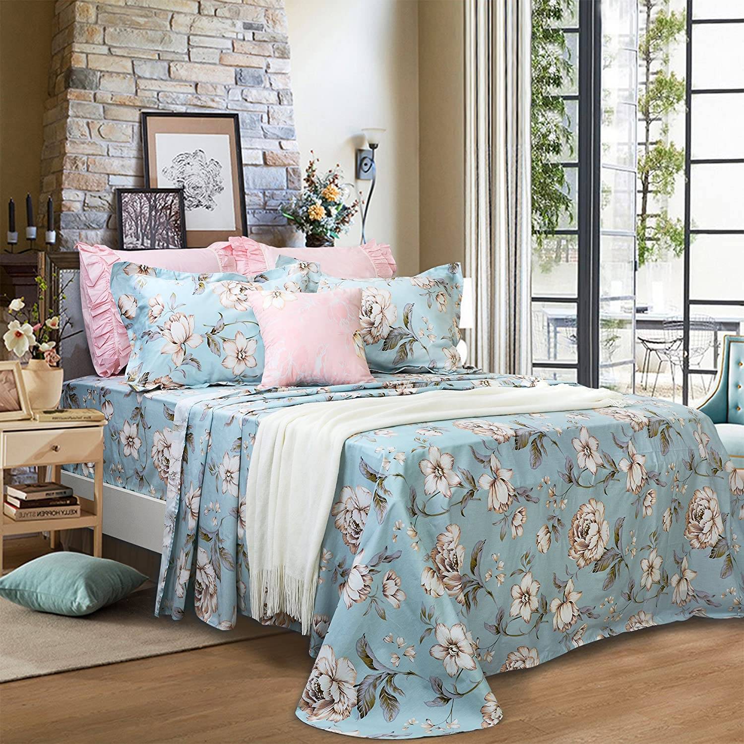 Bed with blue and pink floral sheets