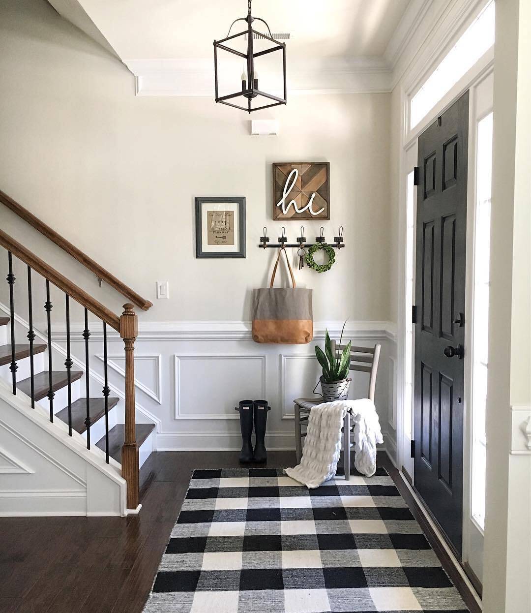 Black and white rug under the stairs