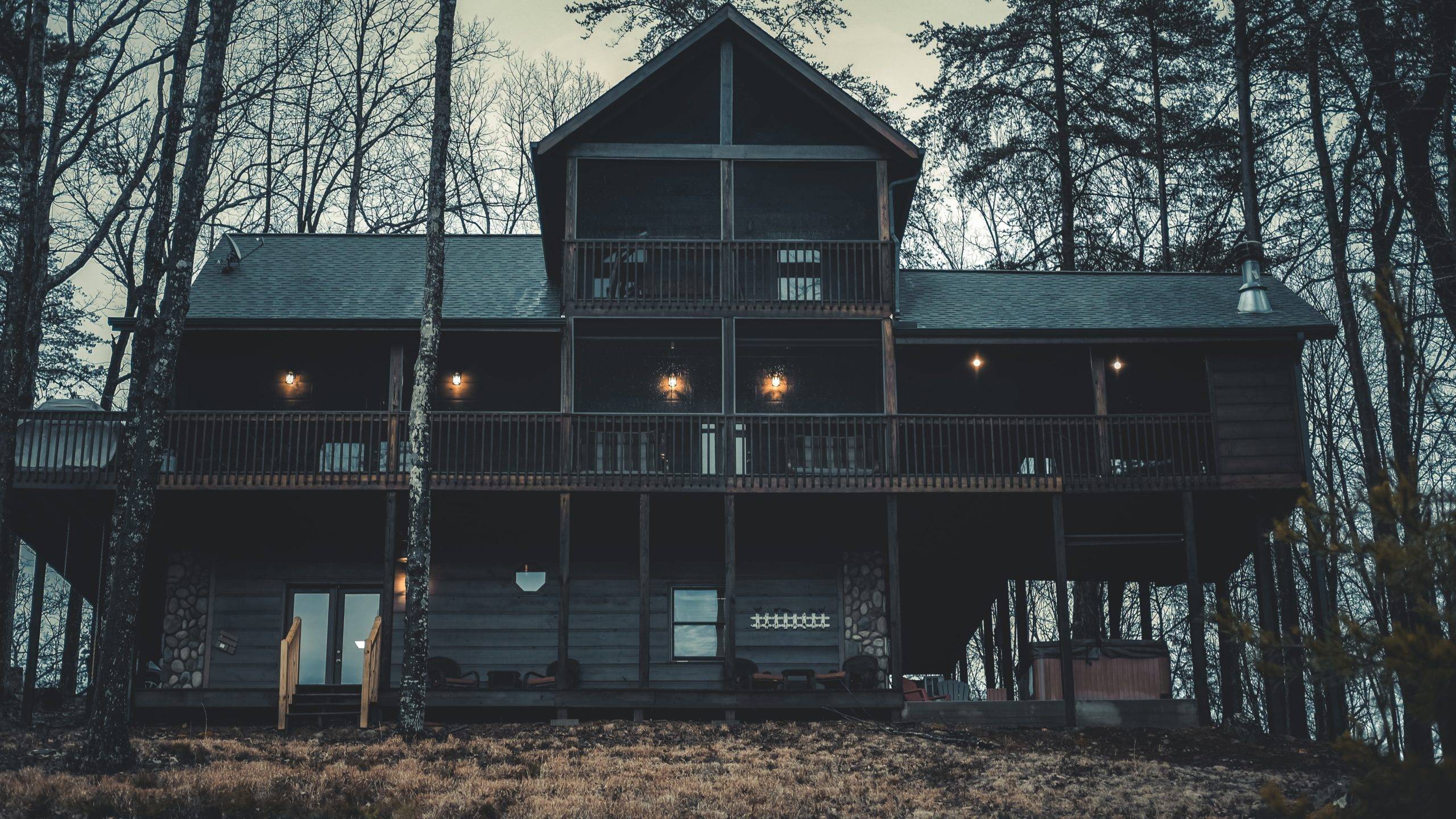 Black house exterior with lamps