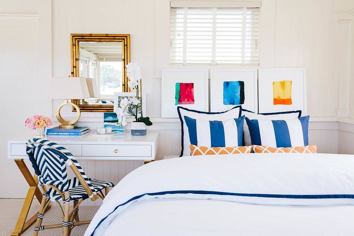 Brilliant pops of blue steal the spotlight in this modern beach style bedroom