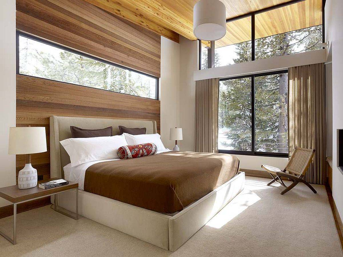 Clerestory windows at different heights bring plenty of natural light into this contemporary bedroom