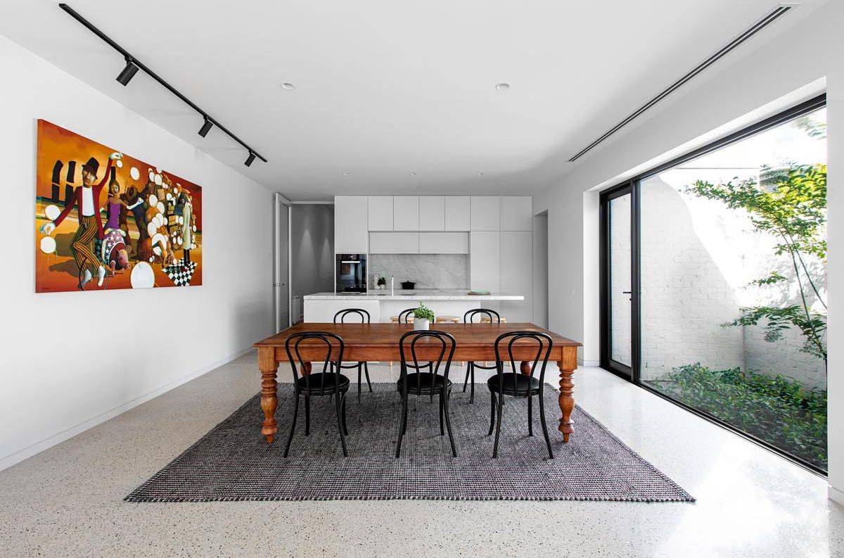 Closer look at the dining area and the kitchen of the Melbourne home