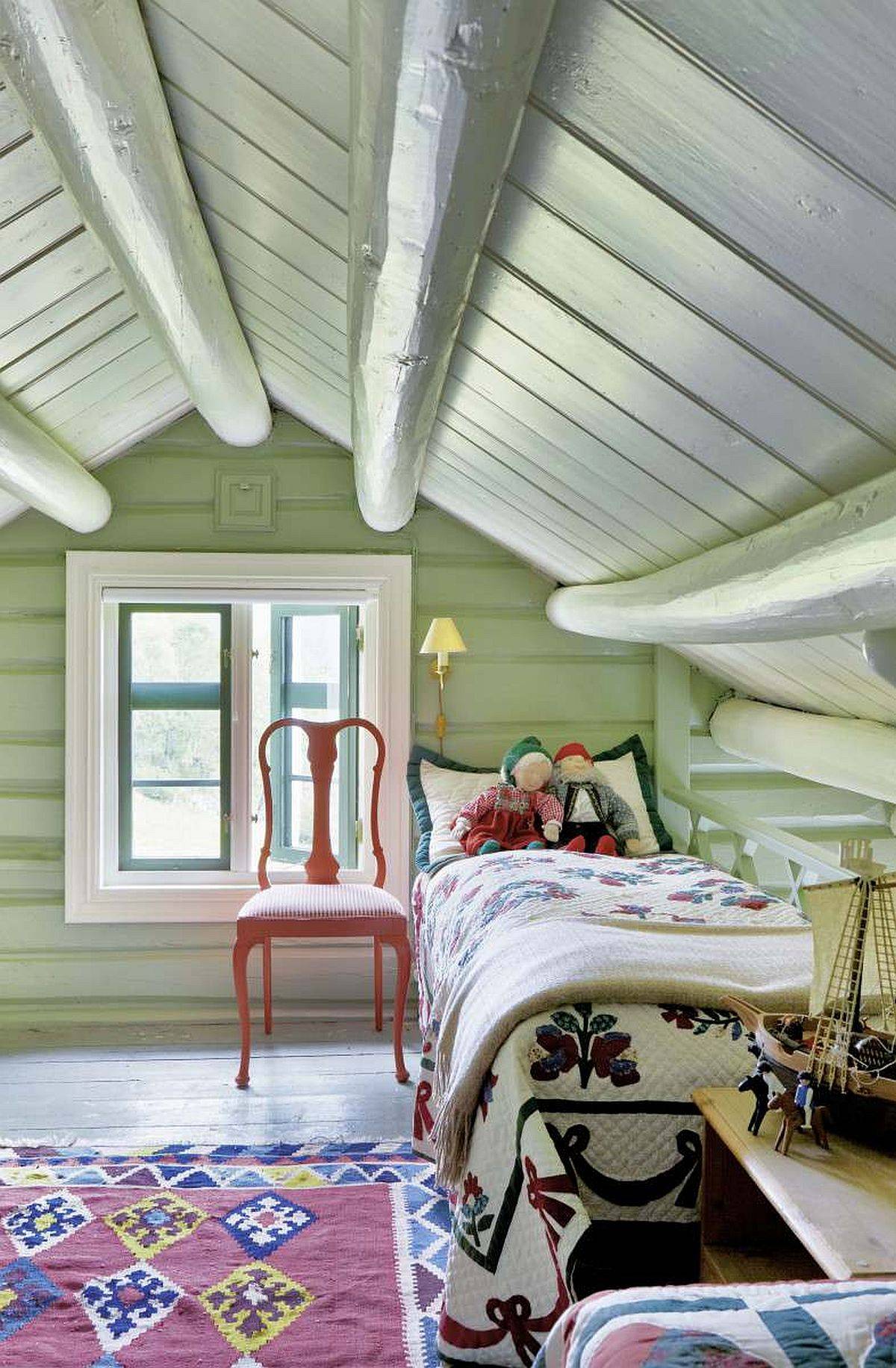 Cozy attic kids' bedroom with paste green in the backdrop