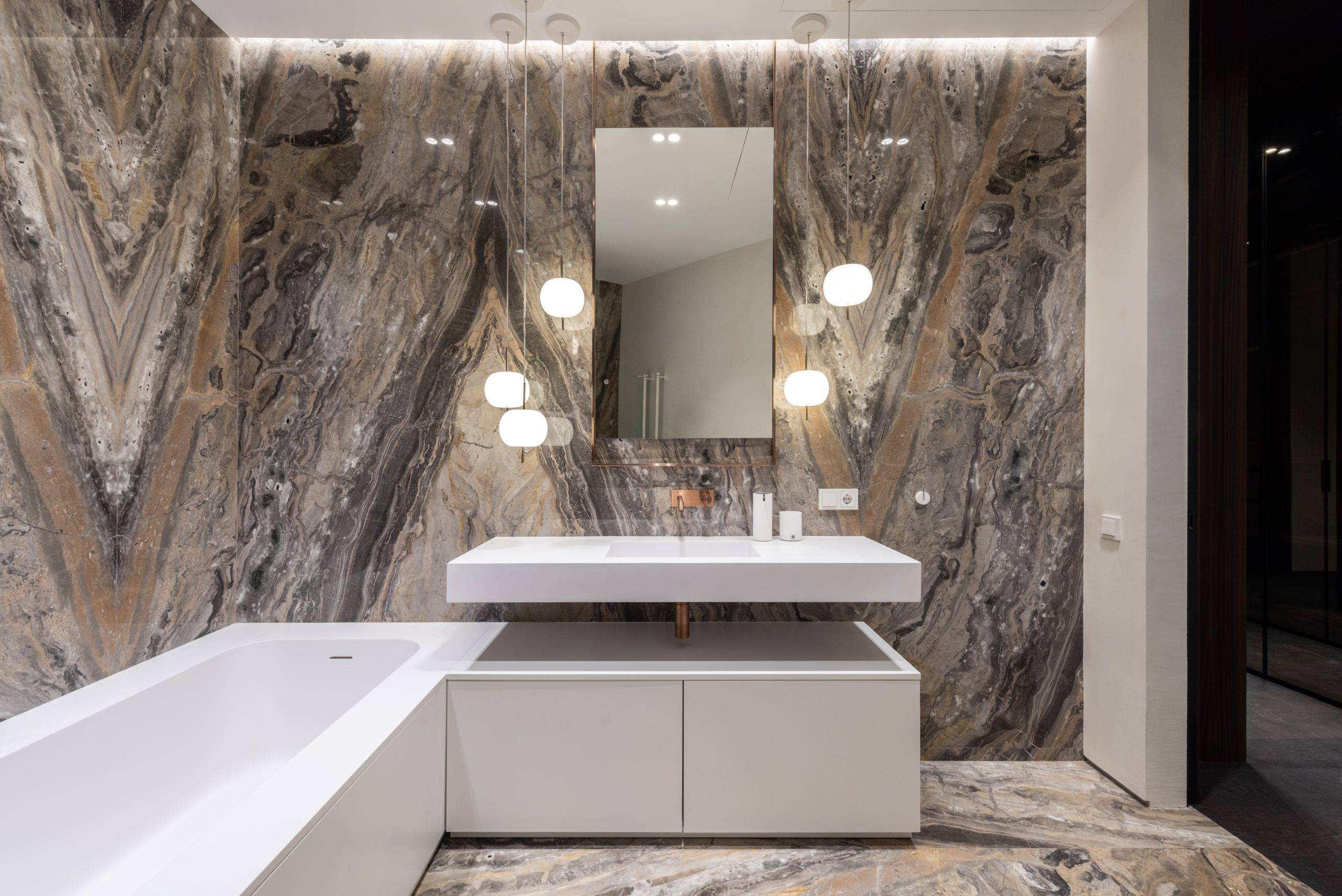 Elegant bathroom with white tub and sink