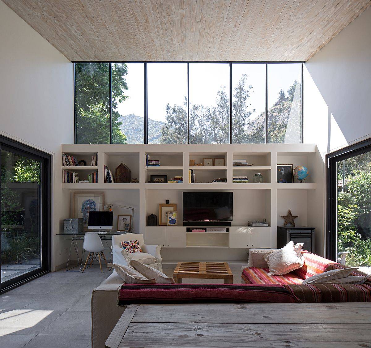 Fabulous double height living room with clerestory windows that offer a view of the Andes mountains