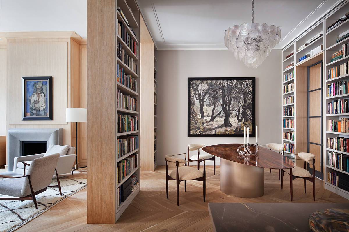 Floor-to-ceiling-bookshelves-create-a-unique-identity-for-this-dining-area-despite-it-being-a-part-of-the-living-room-50188