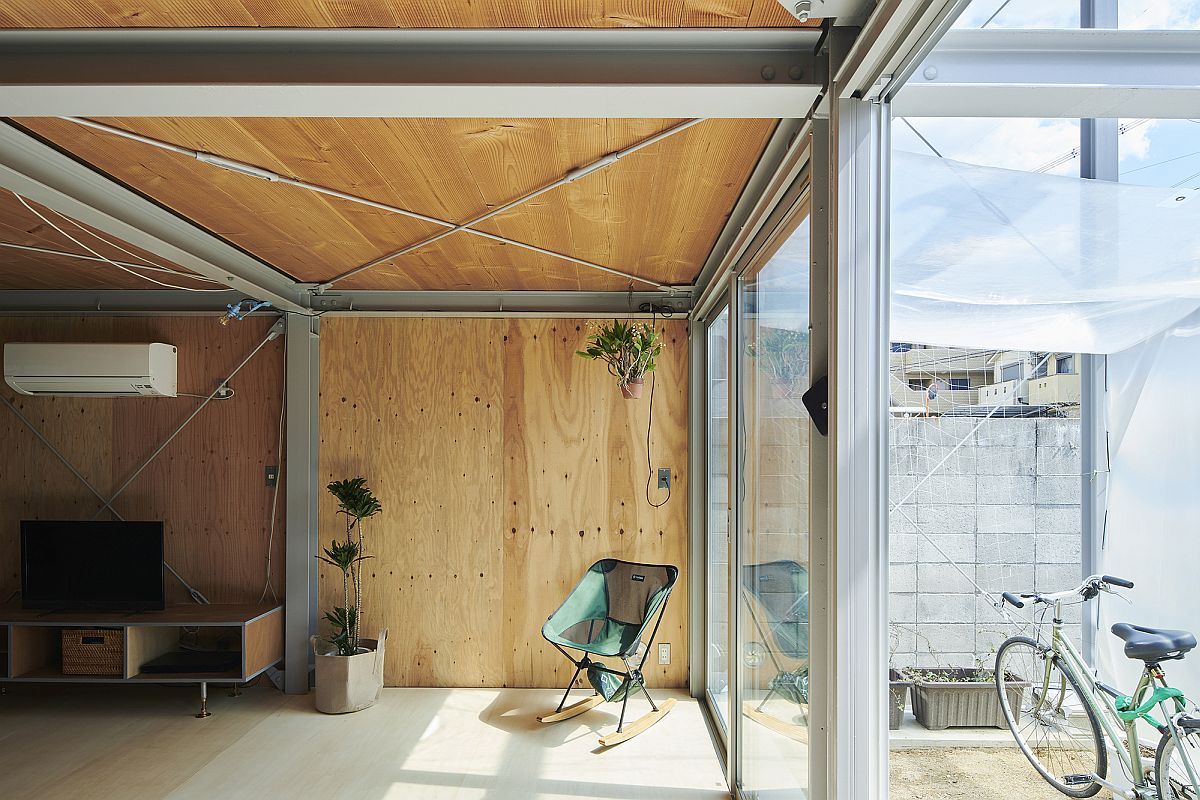 Glass doors and steel structure allow for light to find its way indoors