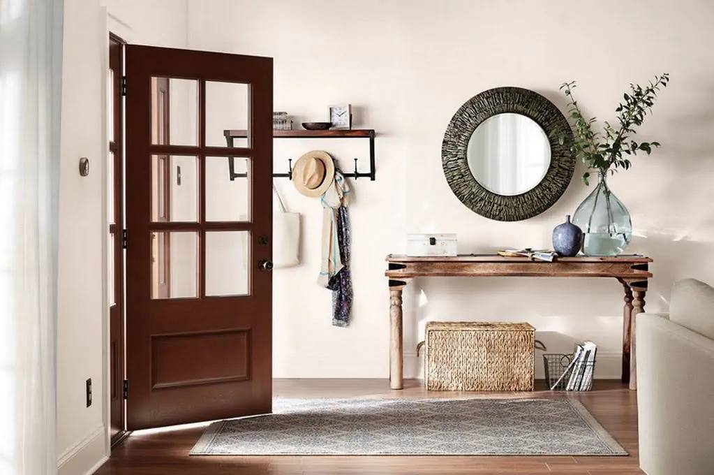 Hallway-with-round-mirror-and-desk