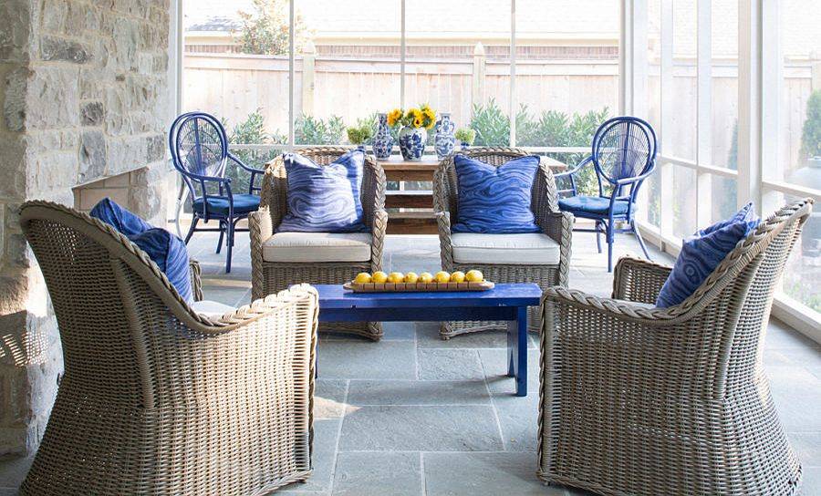 Modern shabby-chic porch with stone and glass walls, decor in natural materials and brilliant splashes of blue