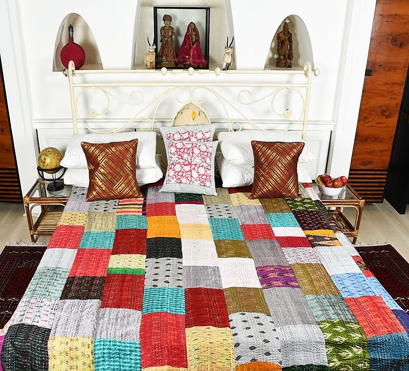 Multi-colored silk printed bed with pillows and cushions