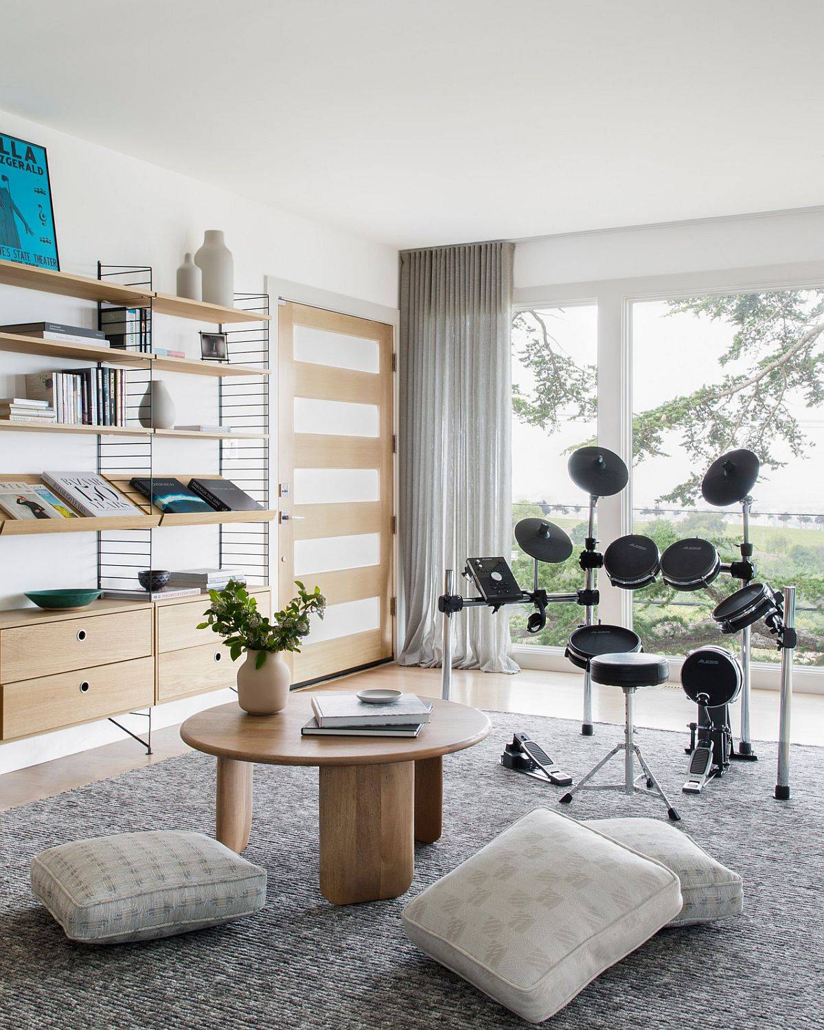 Polished and stylish family room for the musically inclined with floor cushions