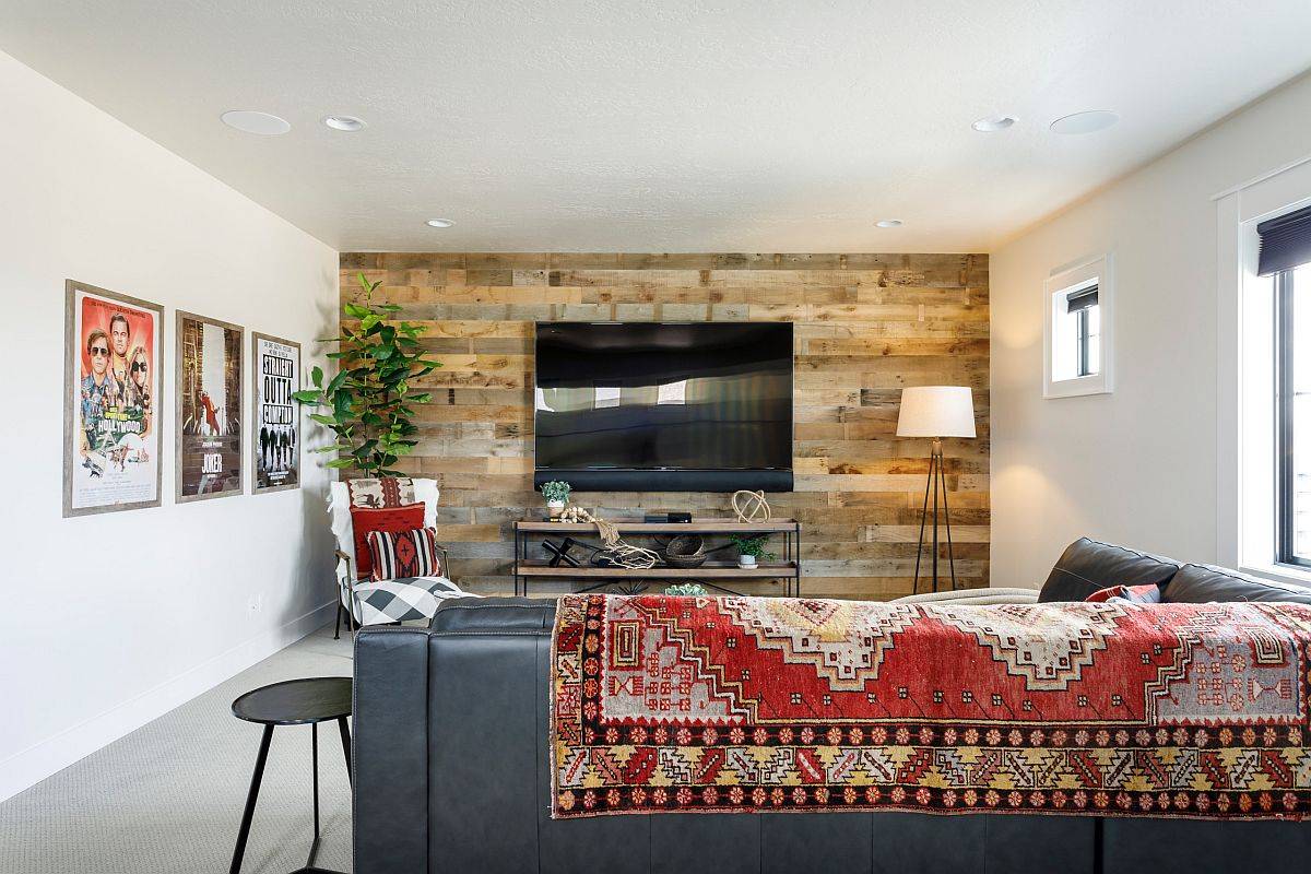 Reclaimed wood accent wall for the small family room in white along with movie posters