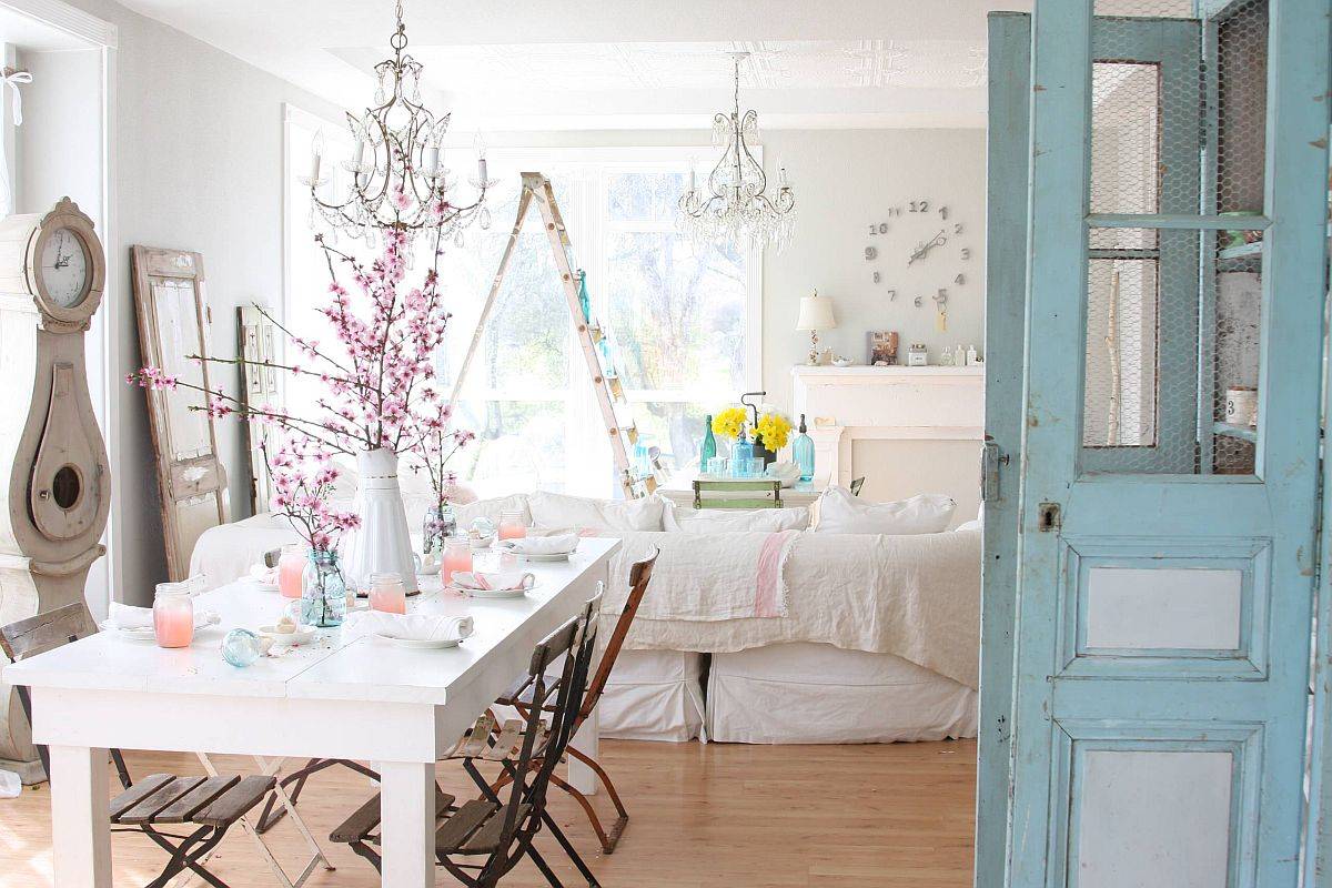 Shabby chic dining area and living room with white decor and ample natural finishes