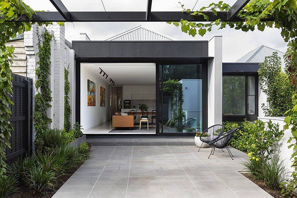 Sliding glass doors leading into the open plan living area of the new rear extension