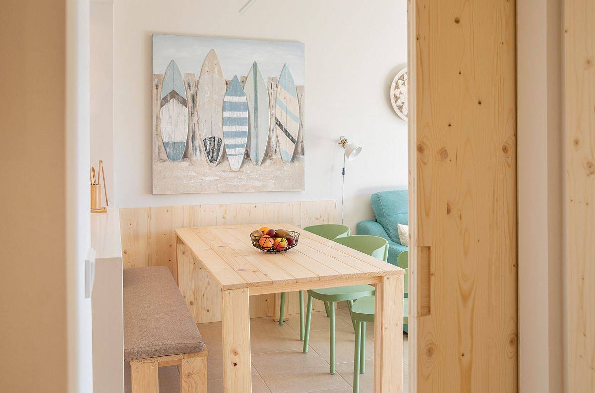 Small beach style dining room in the corner becomes a part of the living area