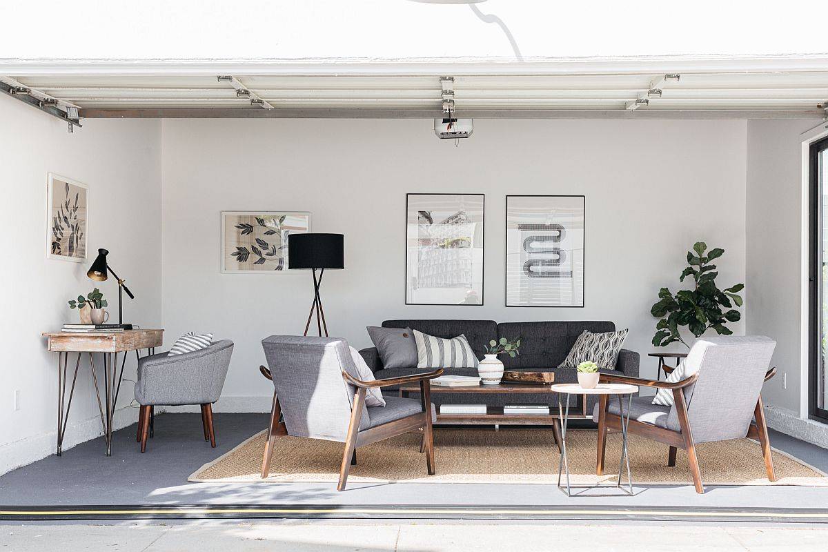 Smart modern farmhouse style family room in gray with small workstation in the corner