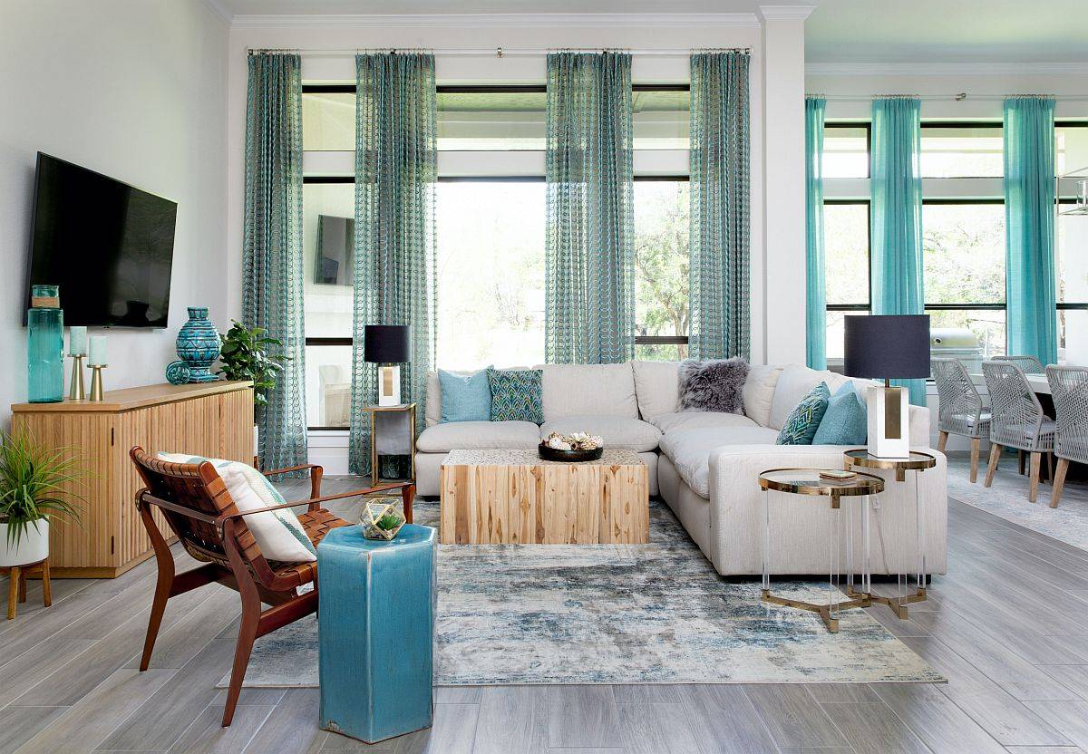 Spacious wood and white family room with blue accents all around