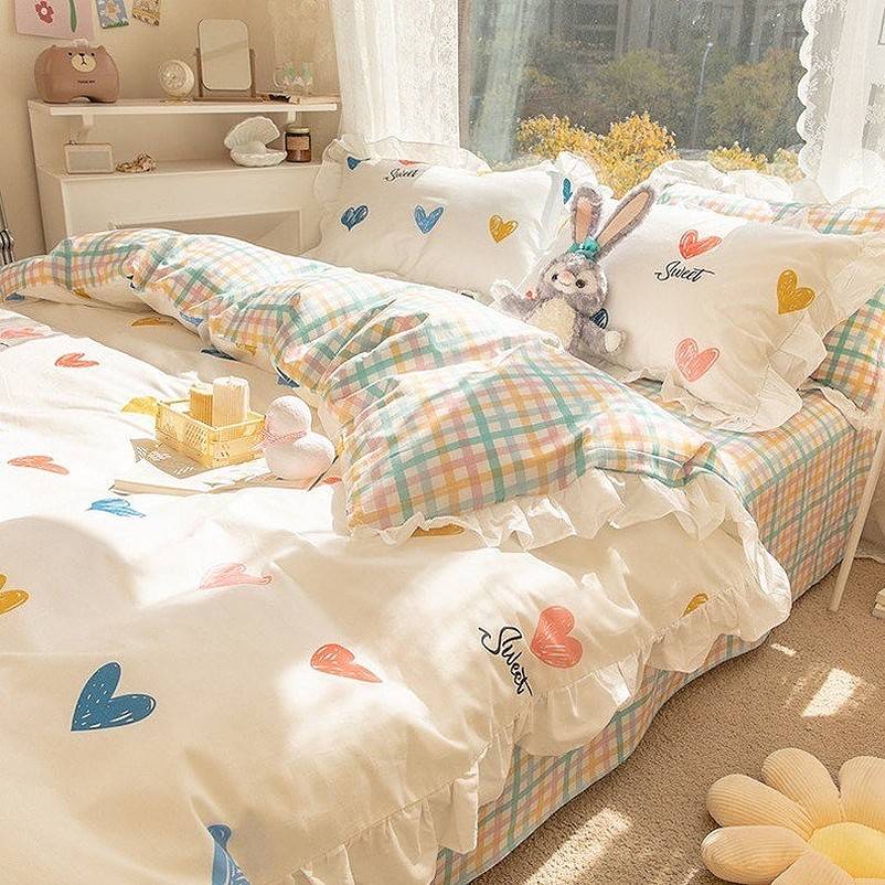 Stuffed rabbit on colorful bed