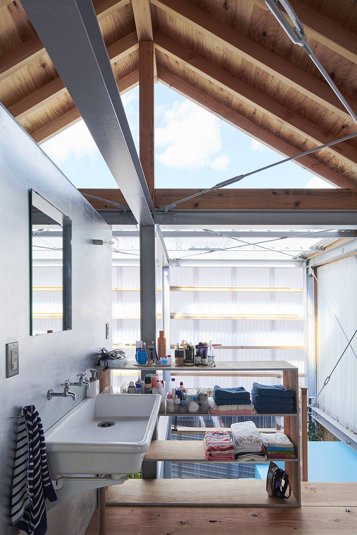 Translucent polycarbonate sheets bring privacy and light to this Japanese home