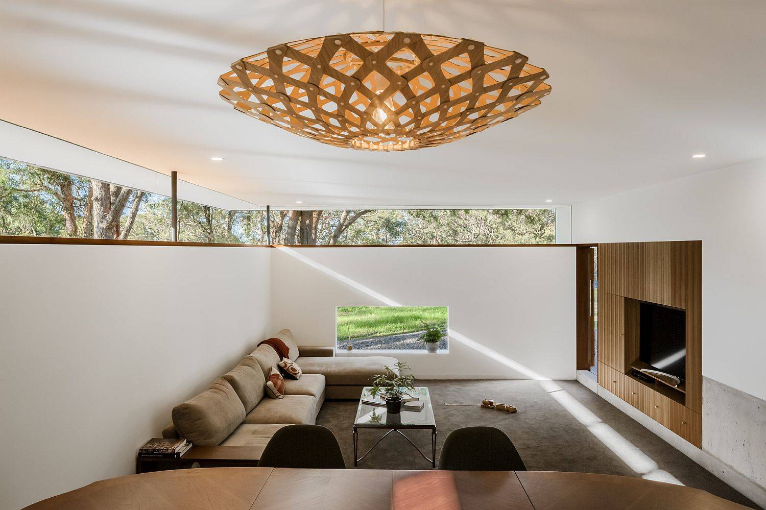 Use clerestory windows to add both brightness and greenery to the modern home