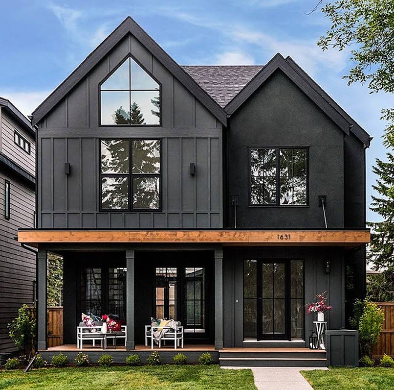 White furniture in the patio of a black house