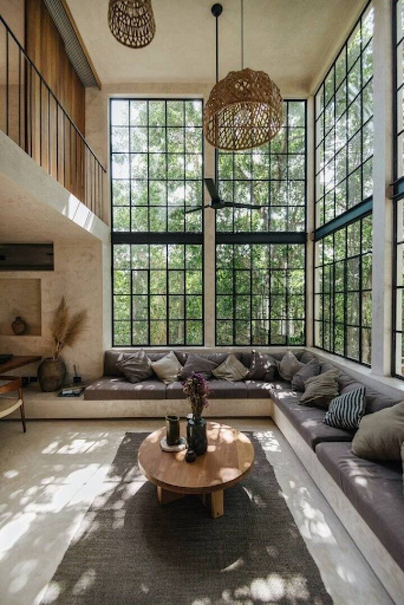 Two Floored Floor to Ceiling Windows in Living Area