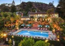 Backyard-of-the-house-with-palm-trees-pool-area-multiple-garders-and-sparkling-lighting-at-the-Hollywood-Hills-estate-56277-217x155