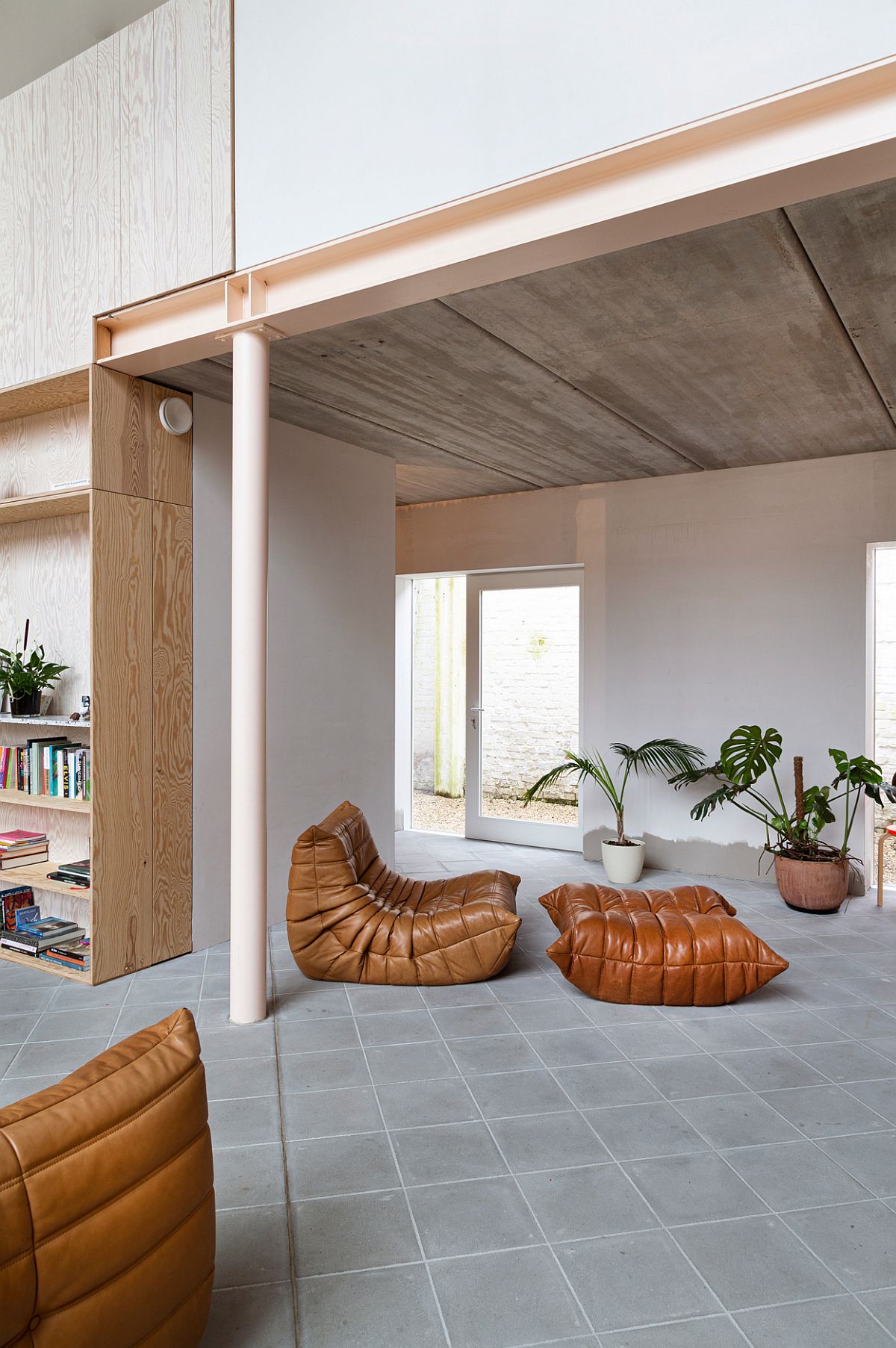 Beautiful Togo sofas in brown become a part of the new hom interior