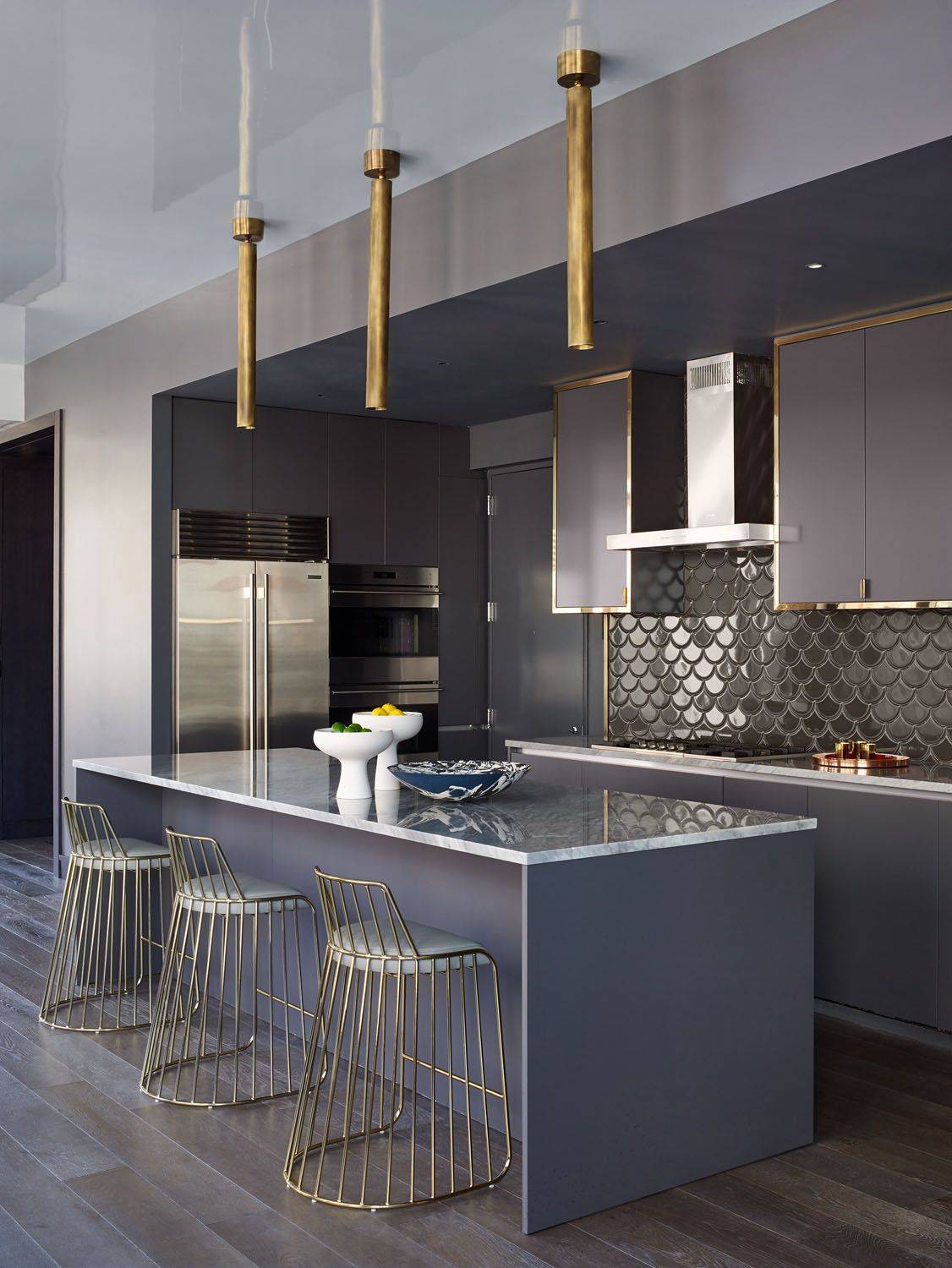 Dark and Gold Themed Kitchen with Dark Backsplash