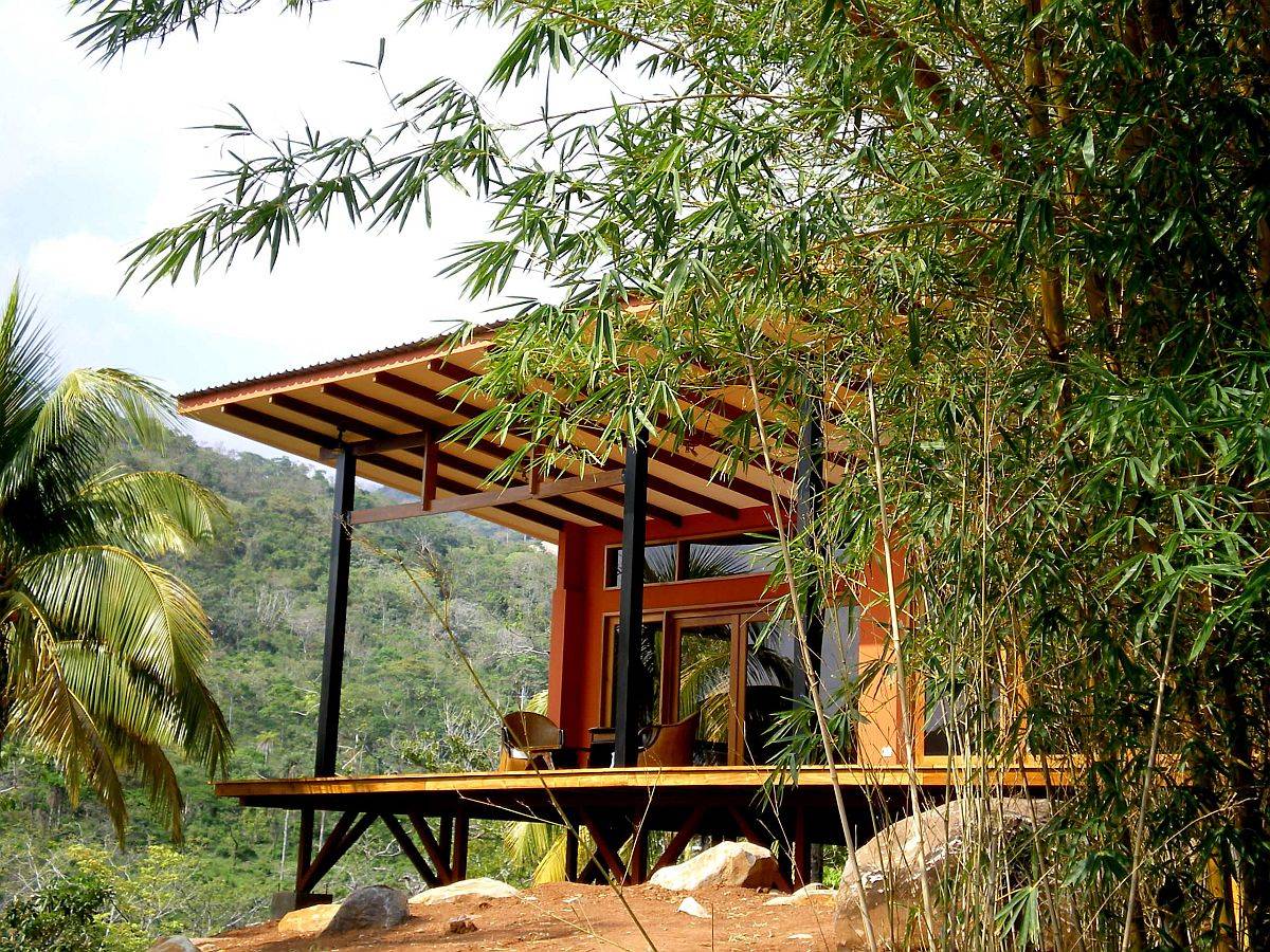 Extended roof of the home keeps the interior cool and provides a shaded outdoor sitting area