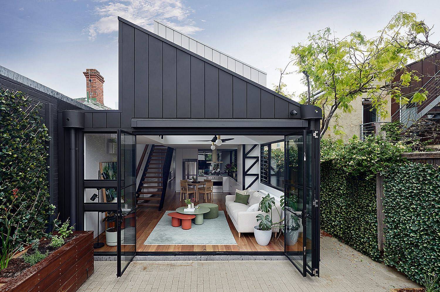 Fabulous-full-width-bi-fold-glass-doors-and-dark-contemporary-section-open-up-the-rear-extension-to-the-world-outside-79041