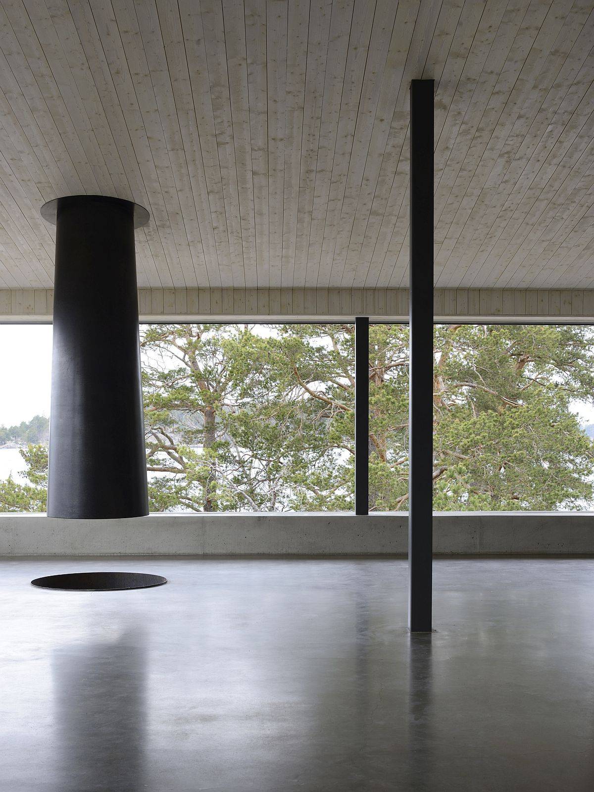 Fireplace suspended from the ceiling is the heart of the new home