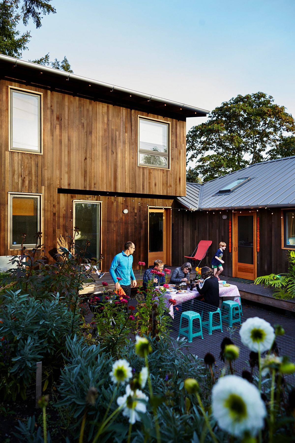 Greenery on one side and elevated decks on the other surround the lovely courtyard