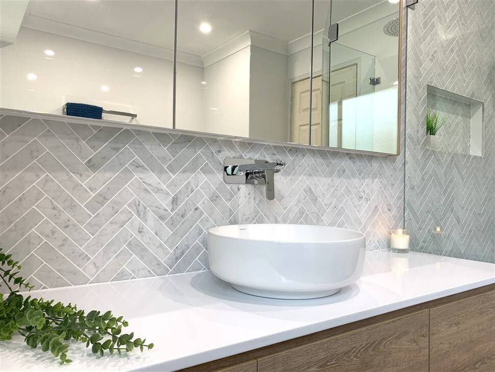 How To Incorporate A Herringbone Pattern Into Your Décor - White Herringbone Wall Tiles Bathroom