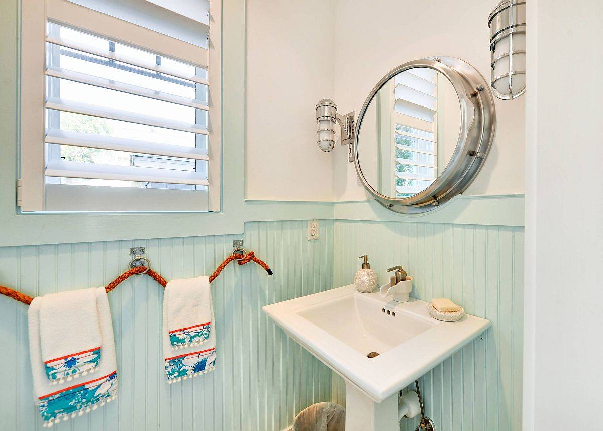 It is hard to find a more pleasing and beautiful coastal style powder room than this