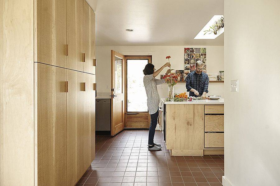 Kitchen and dining area of the Courtyard House in Seattled with a modern extension