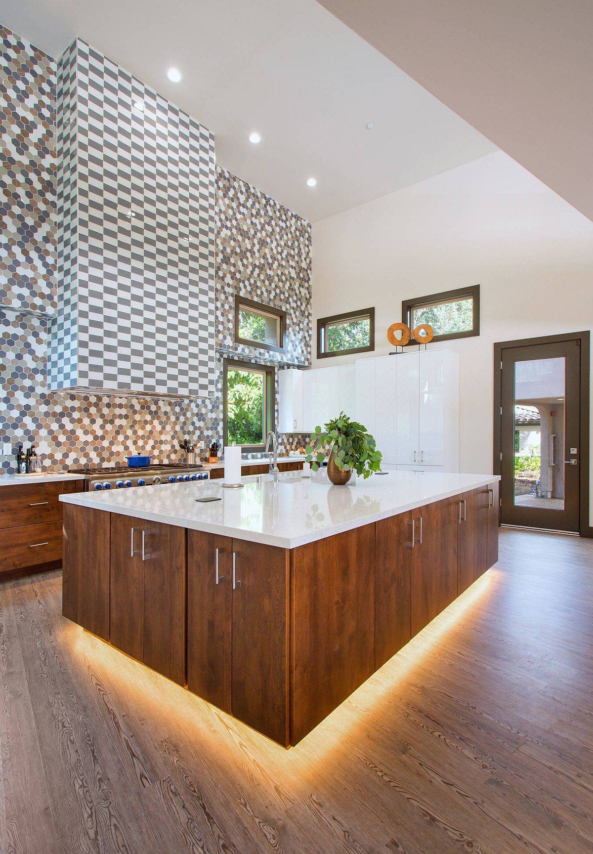 Lighting beneath the kitchen island gives it a fabulous visual appeal