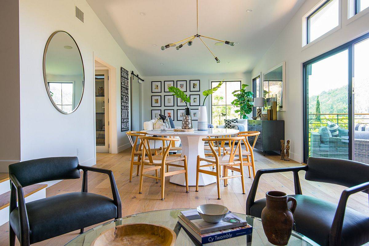 Open plan living area with a small dining space and kitchen along with a lovely gallery wall