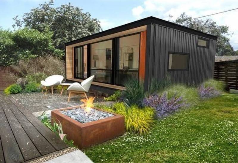 container home with lounge chairs and firepit