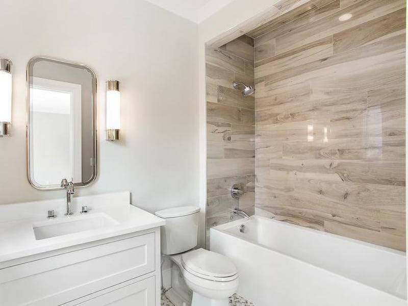 White Bathroom With Wood Tile Accent Wall