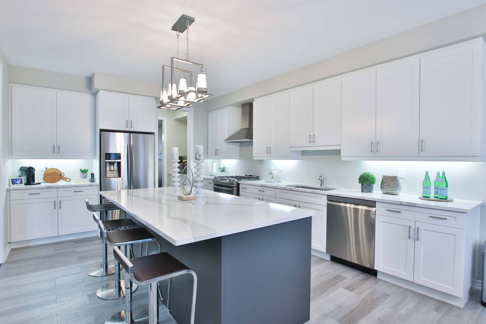 White Cabinets with Metallic Chandeliers