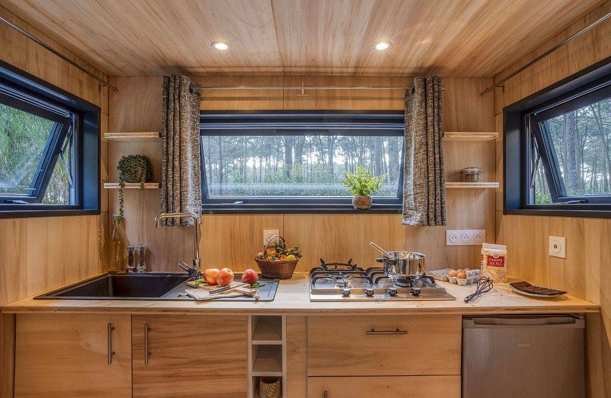 Windows-bring-the-outdoors-into-the-tiny-kitchen-in-wood-with-a-smart-workstation-30274