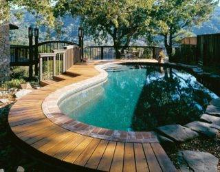 Make A Splash With These Stylish Wood Pool Deck Ideas