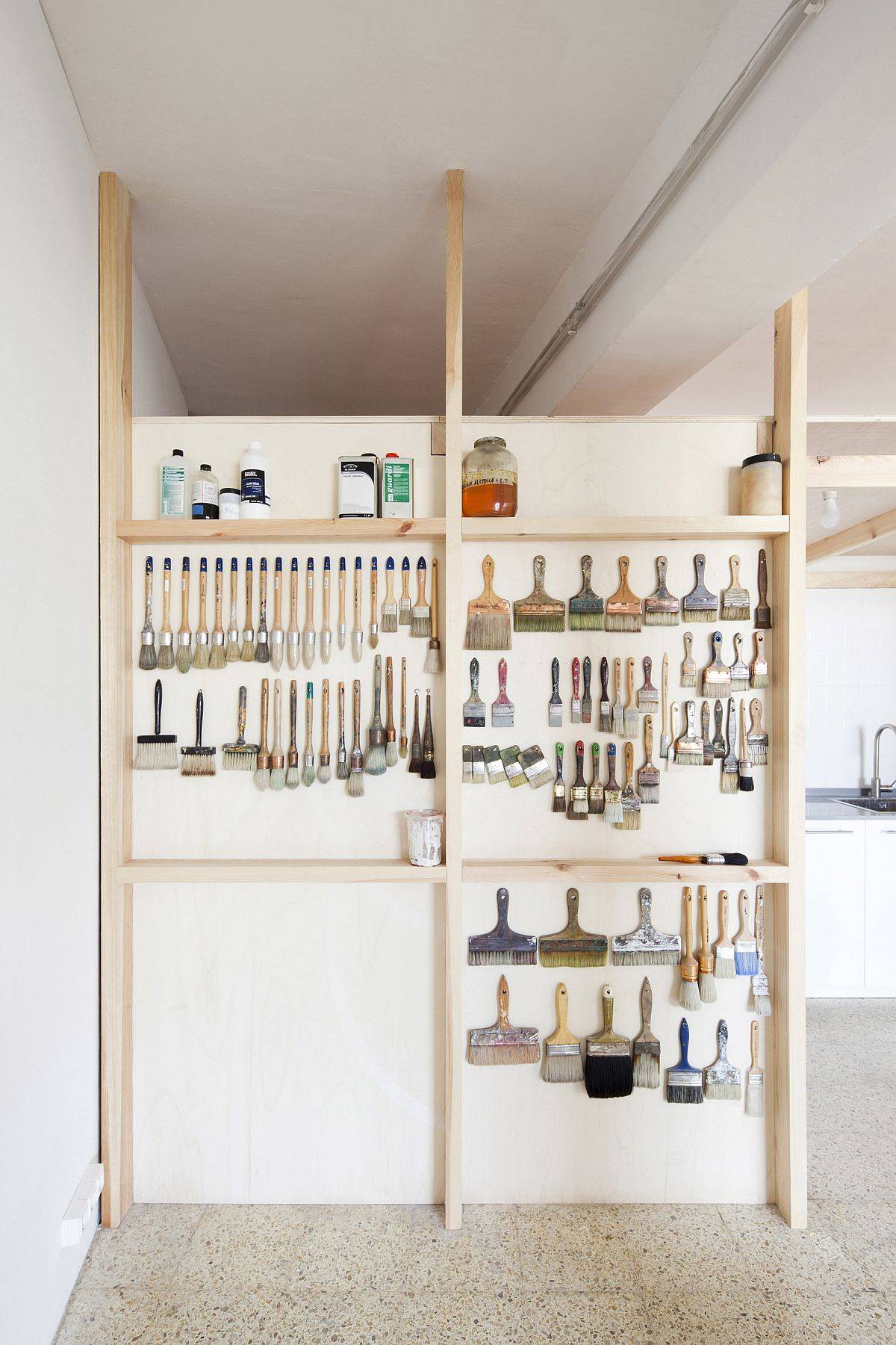 Wooden wall with hooks can easily hold all your hardware