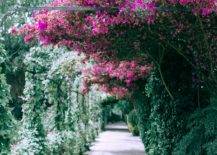 pink floral archway and stone path