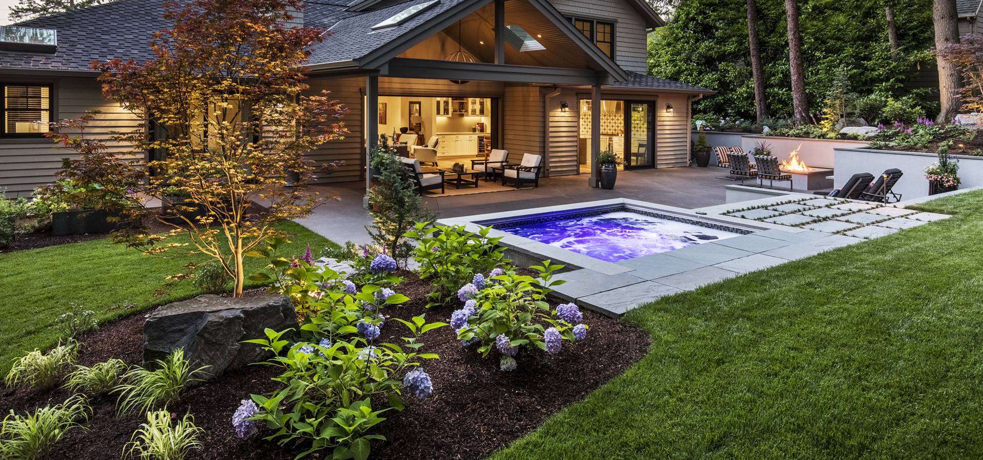  patio, pool, firepit, and stones in backyard